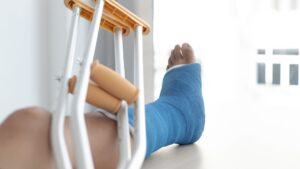 Man in crutches after injury at work