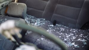 broken glass in the back seat of a car