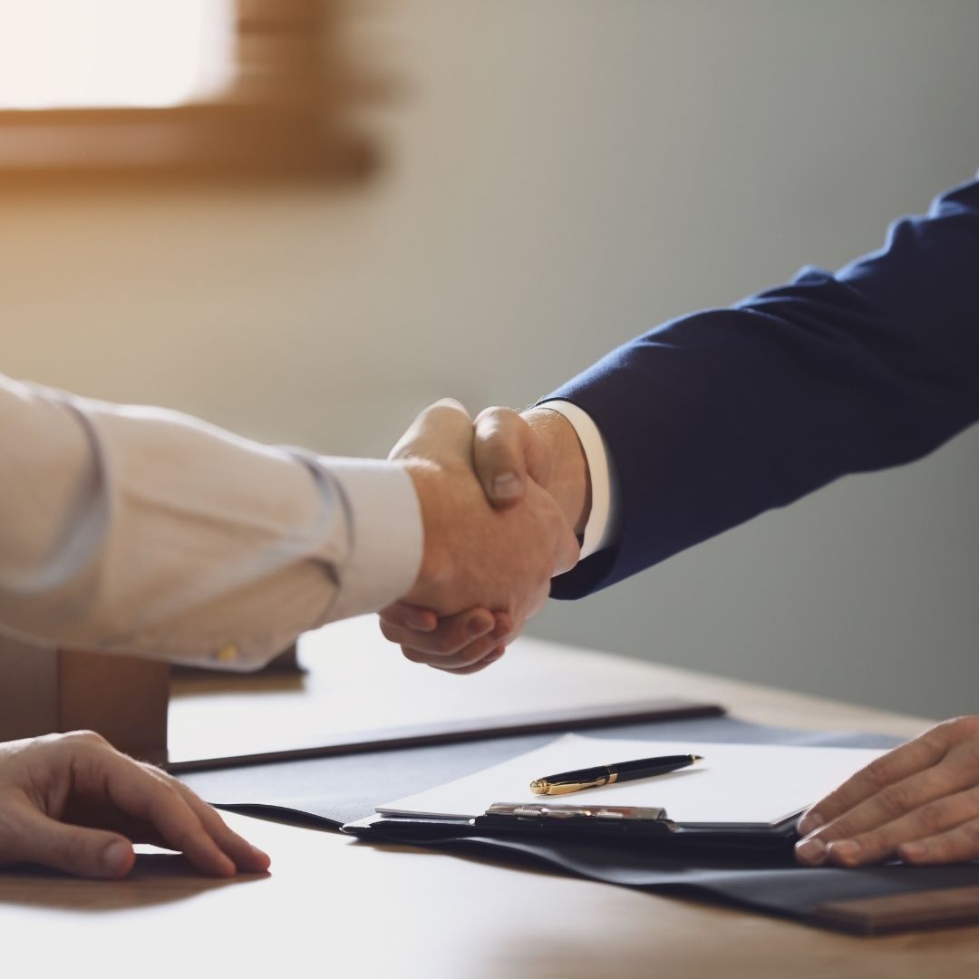 a handshake between a lawyer and client